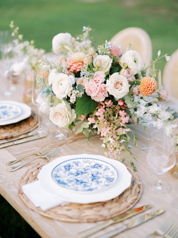 Timeless french country wedding decor set on a wedding table in pink, blush and coral hues.